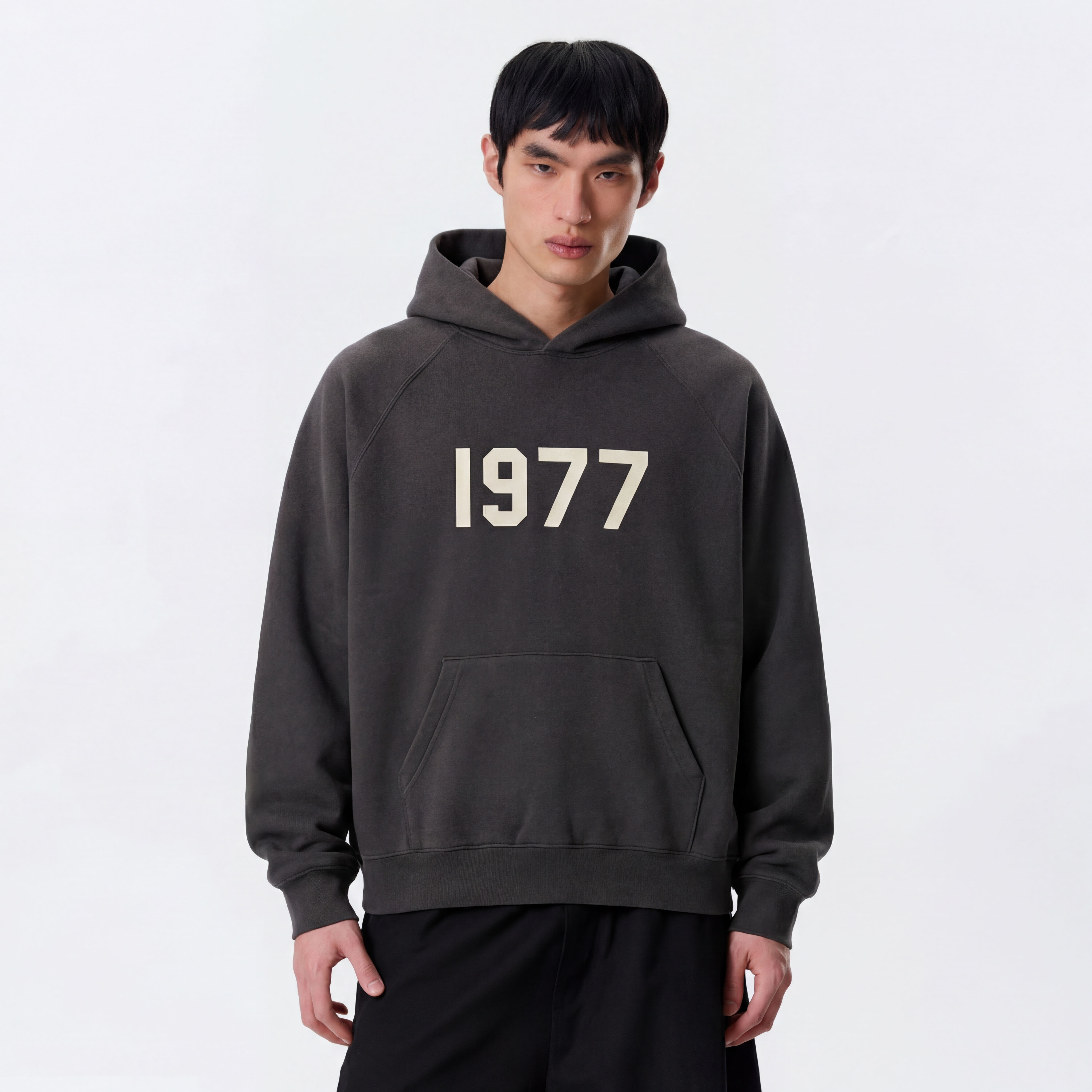 Model wearing essentials 1977 hoodie iron