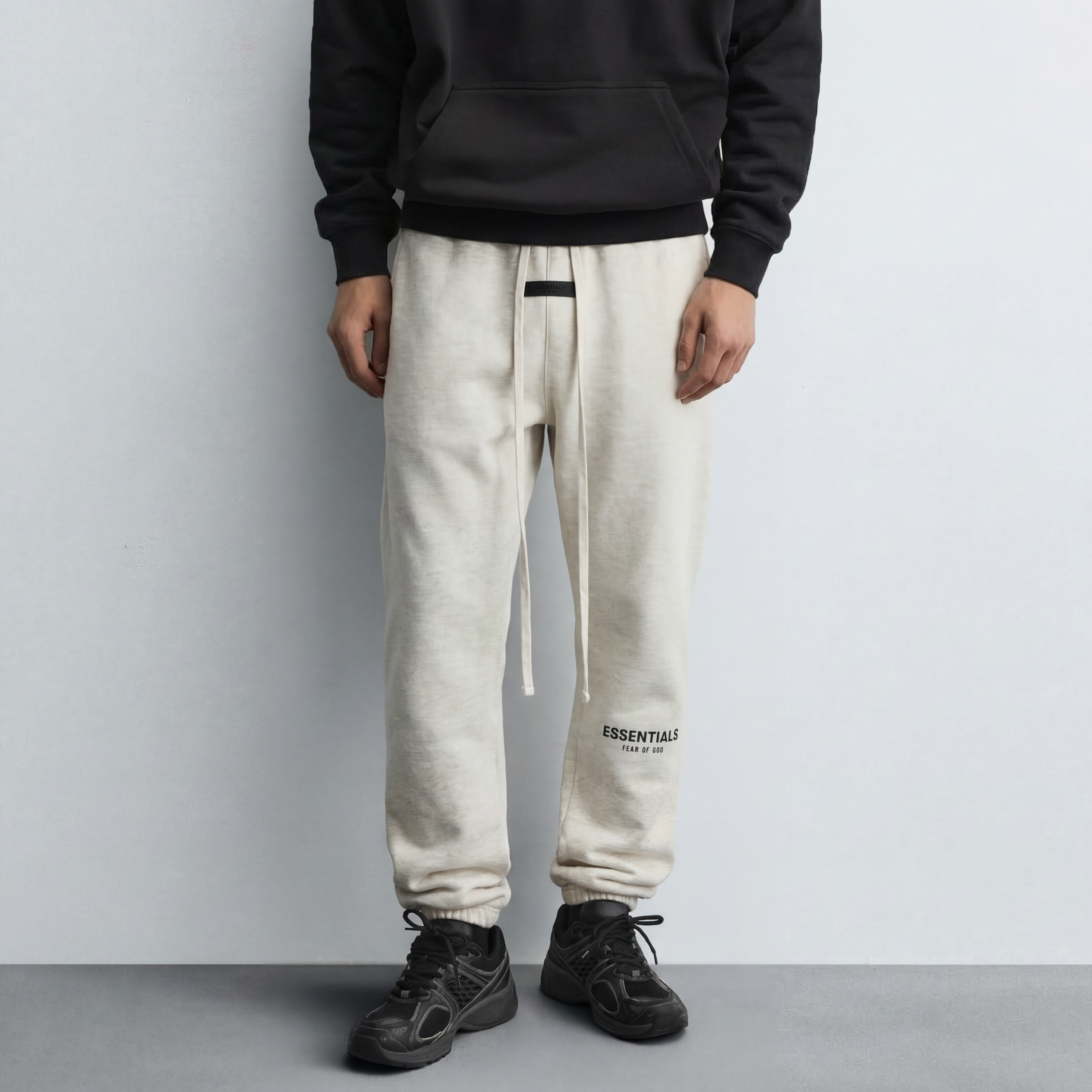 Model wearing regular essentials light oatmeal sweatpants